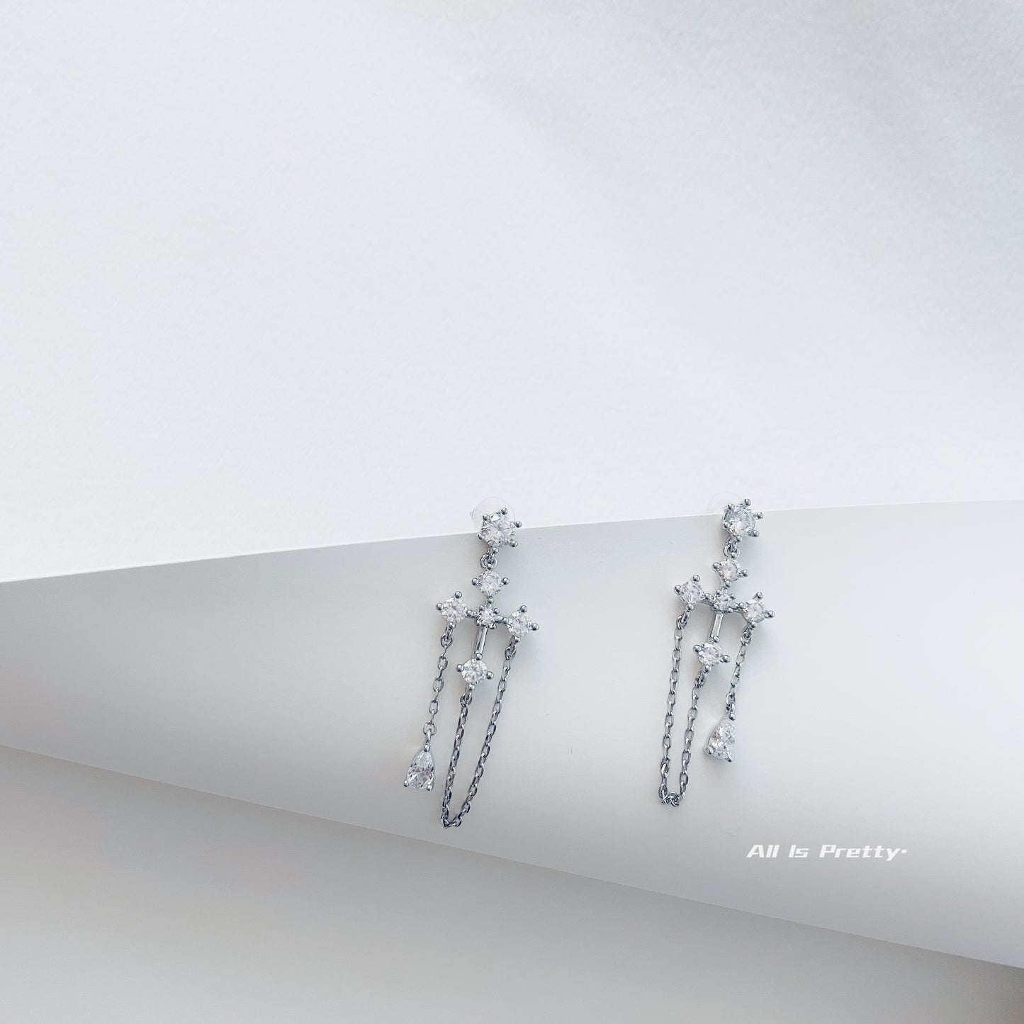 Crystal cross tassel earrings