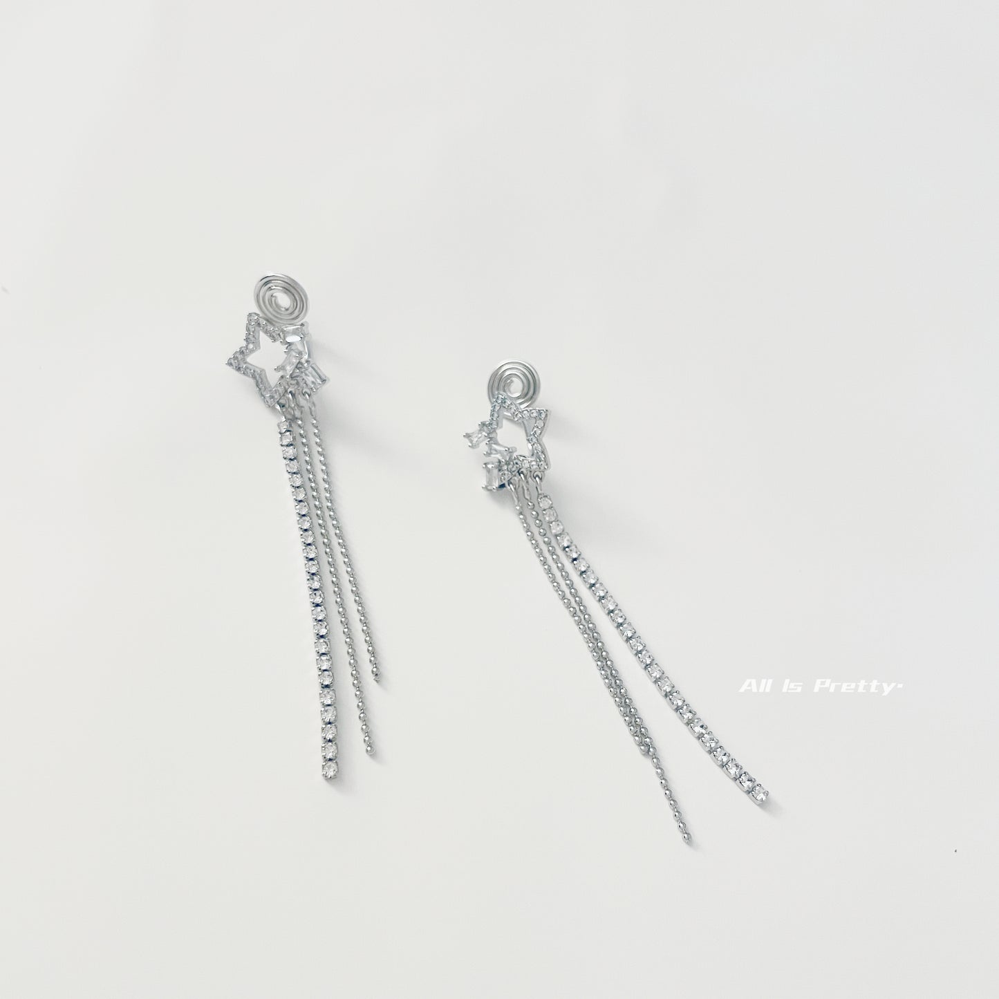 Star tassel clip earrings