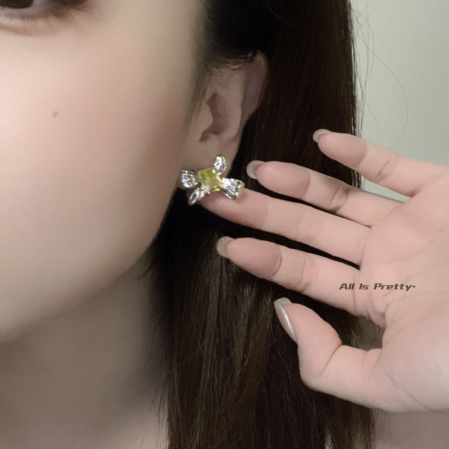Yellow crystal bow stud earrings