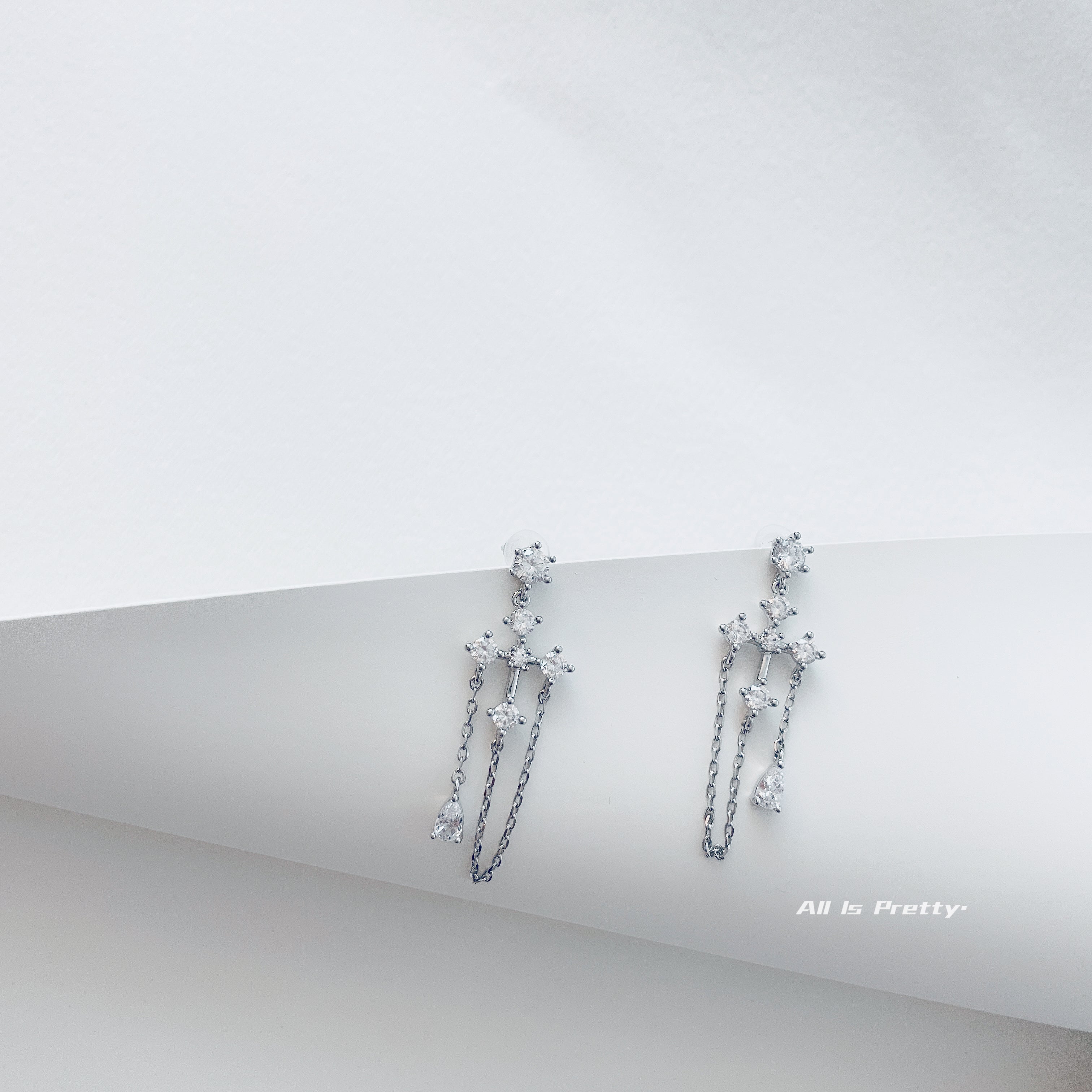 Crystal cross tassel earrings