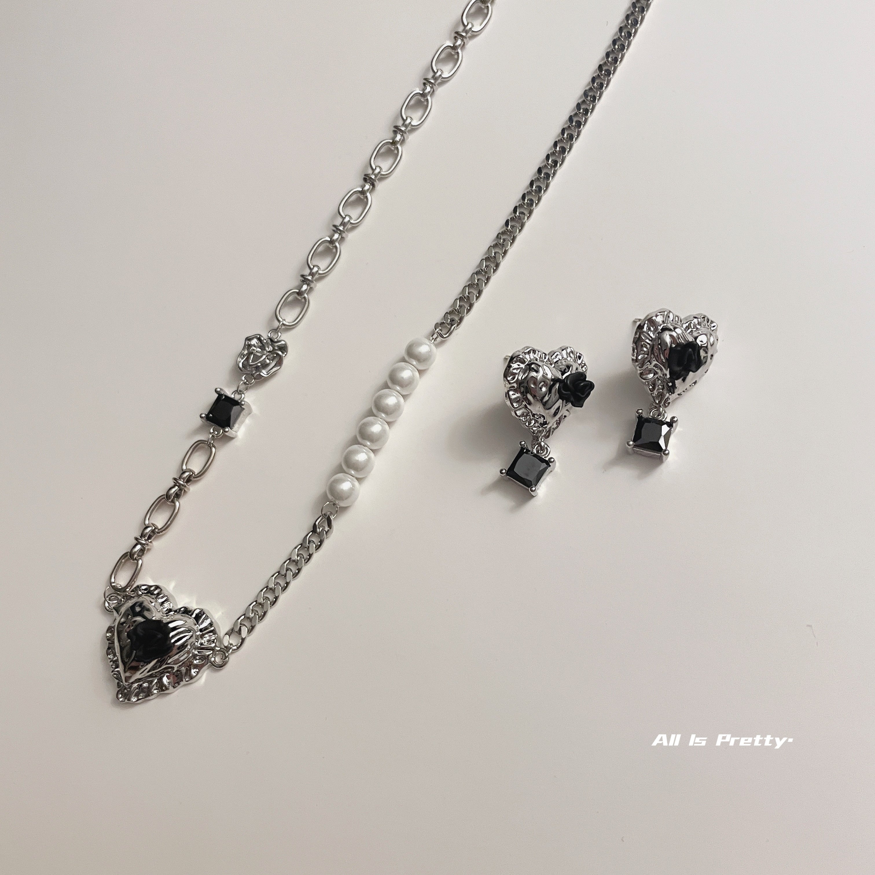 Heart black rose studded earrings