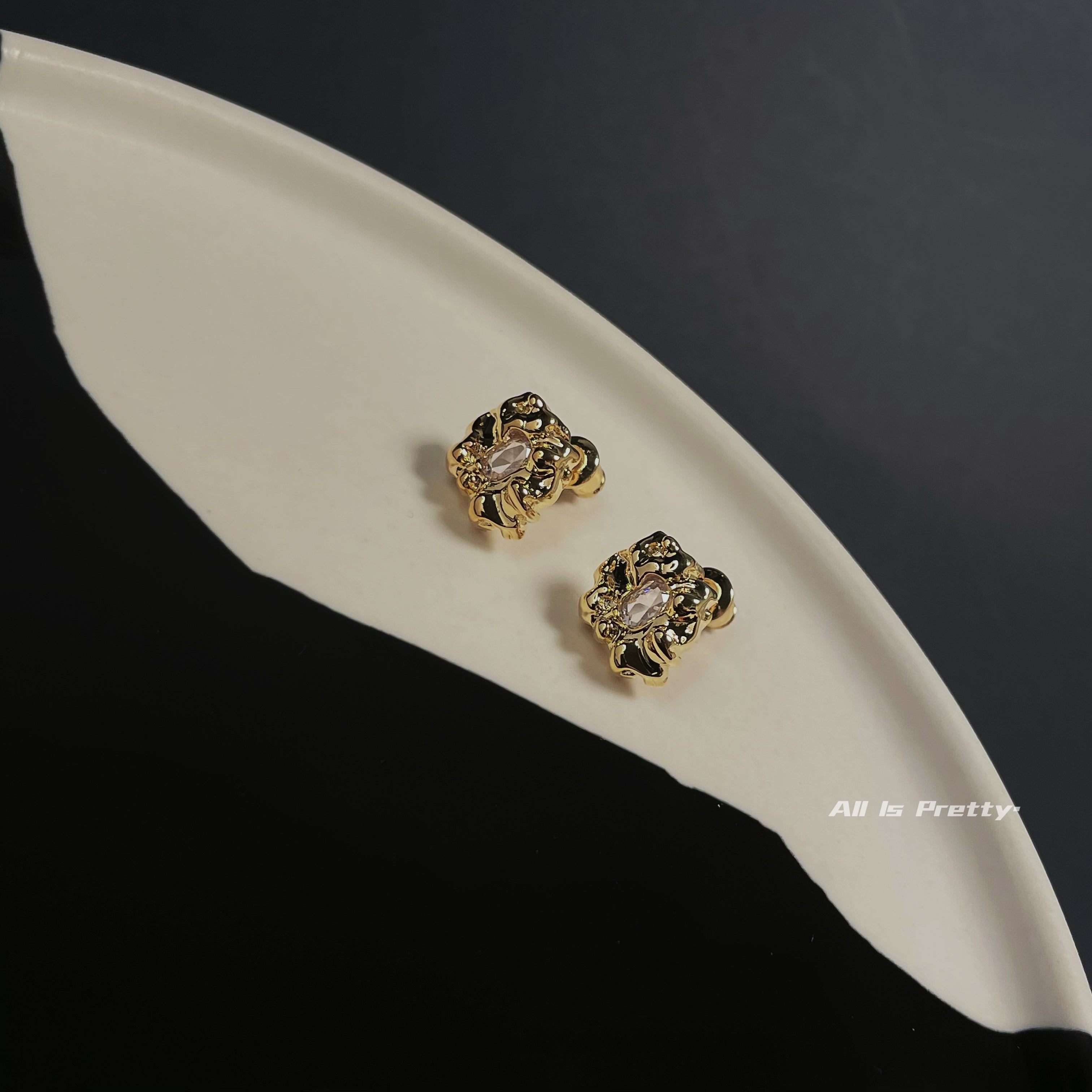 Gold stone studded earrings