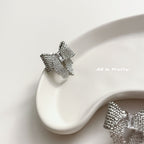 Textured bow studded earrings