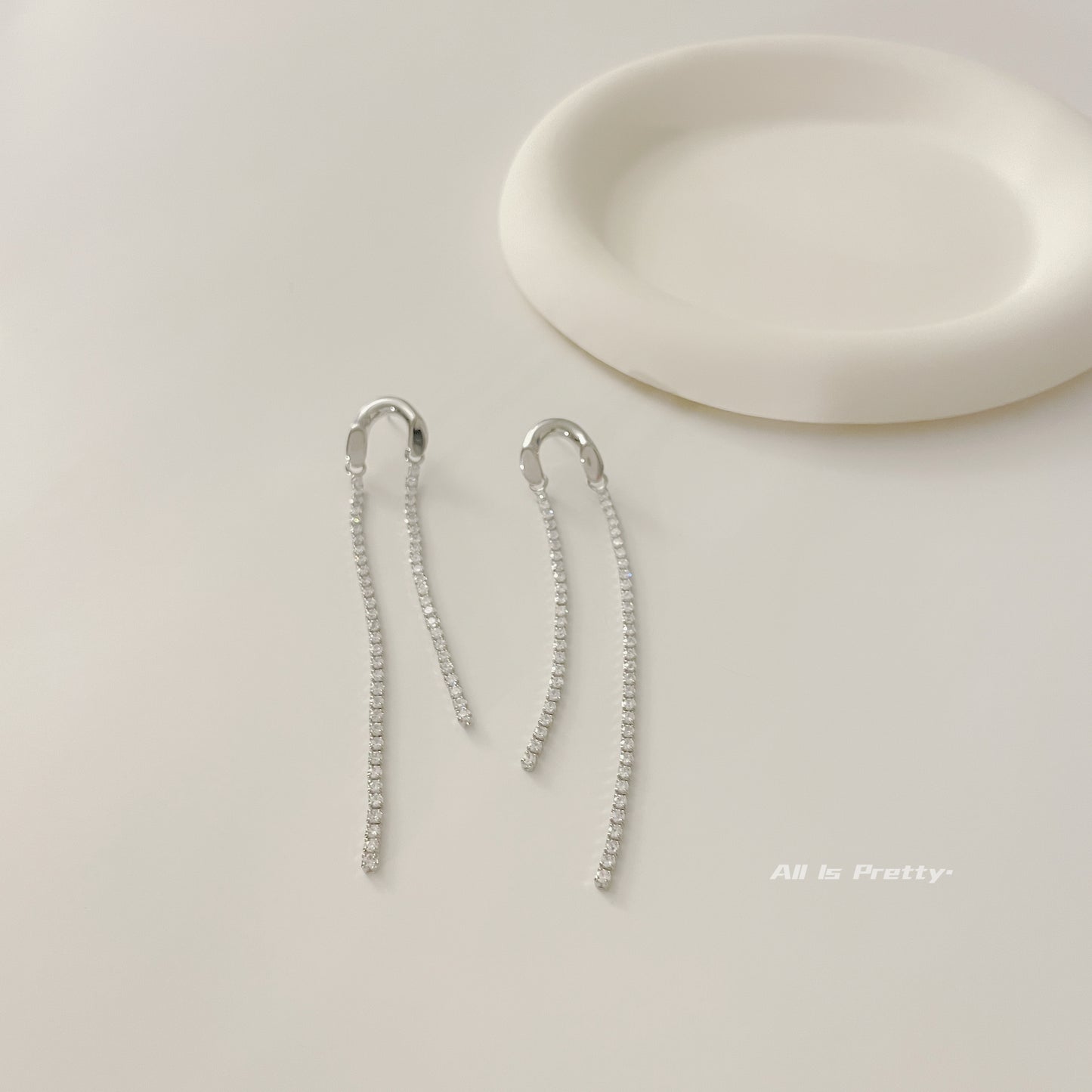 Asymmetric tassel zirconia earrings
