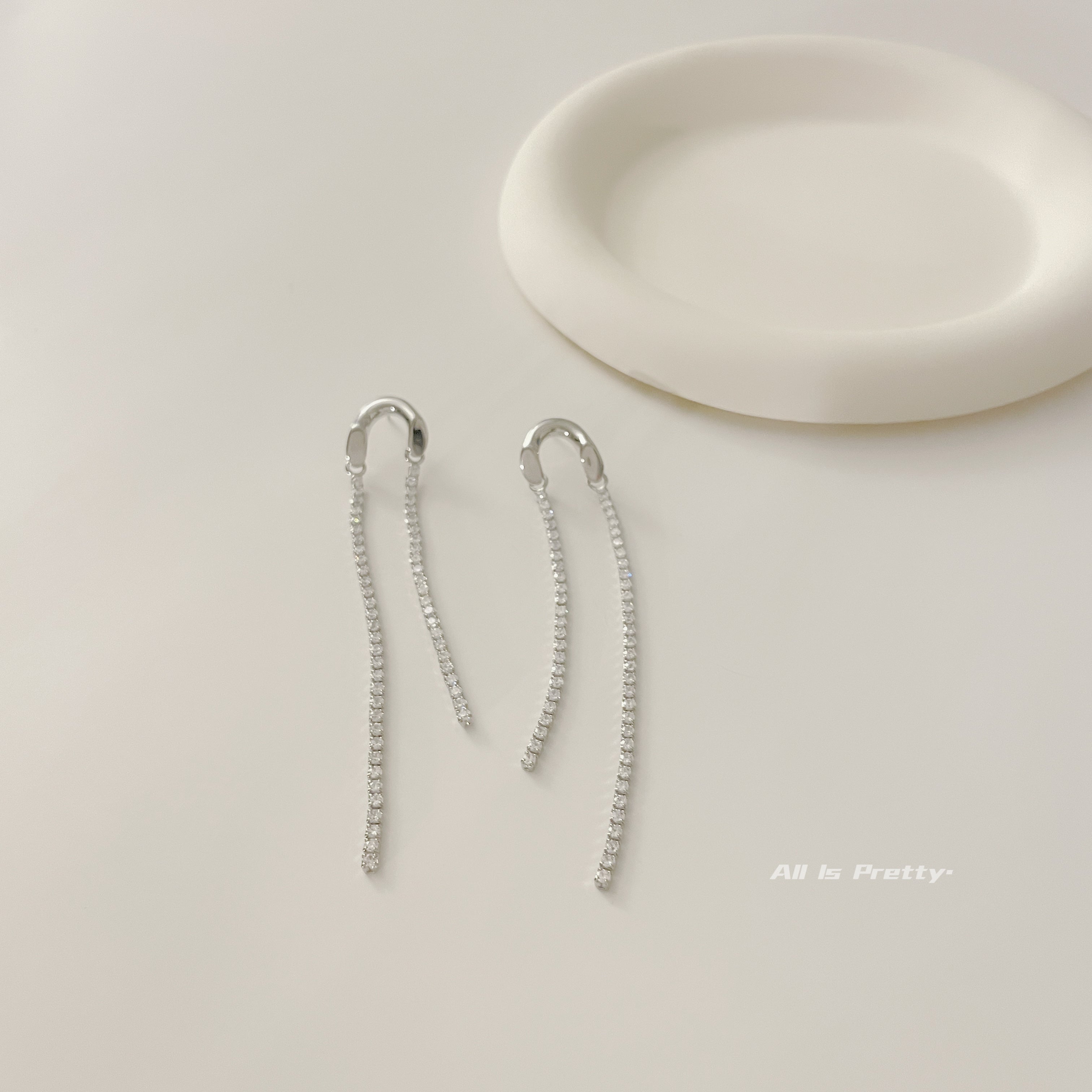 Asymmetric tassel zirconia earrings