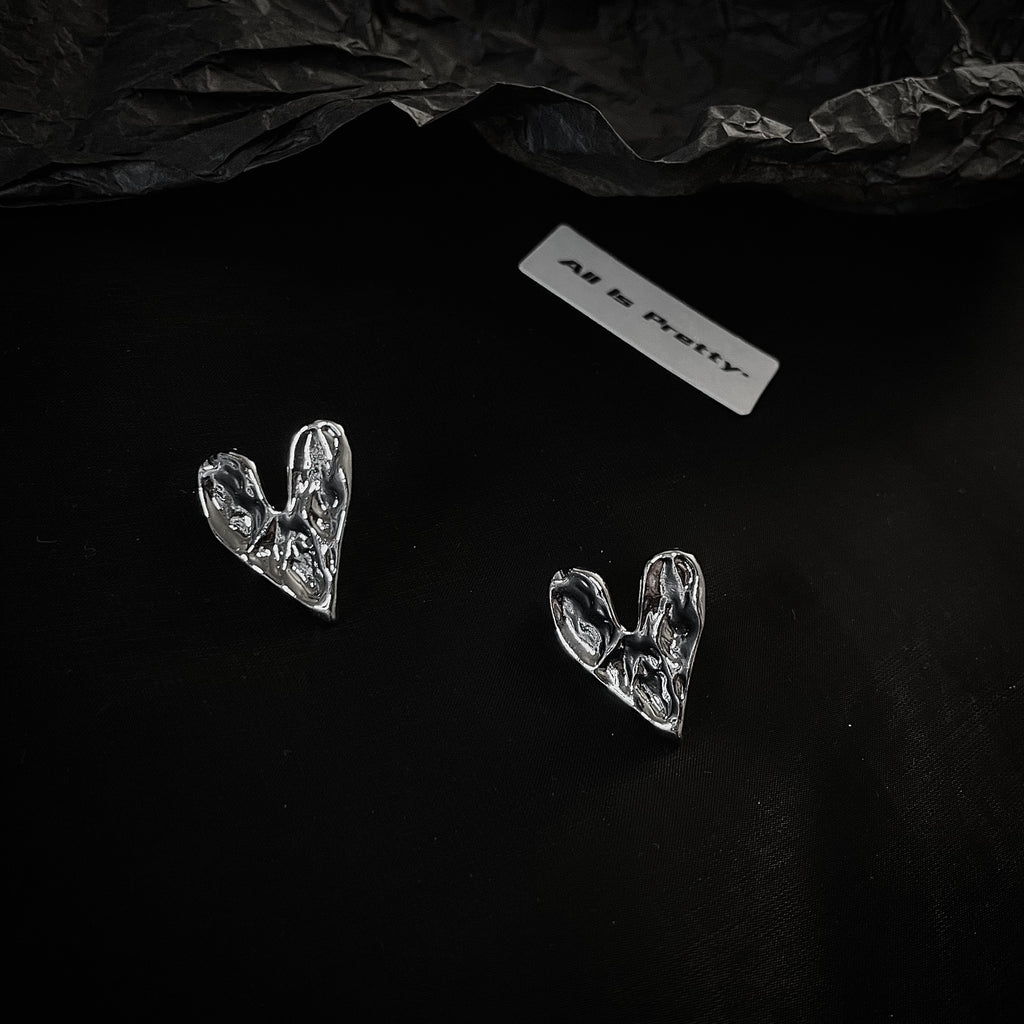 Rough heart shape studded earrings