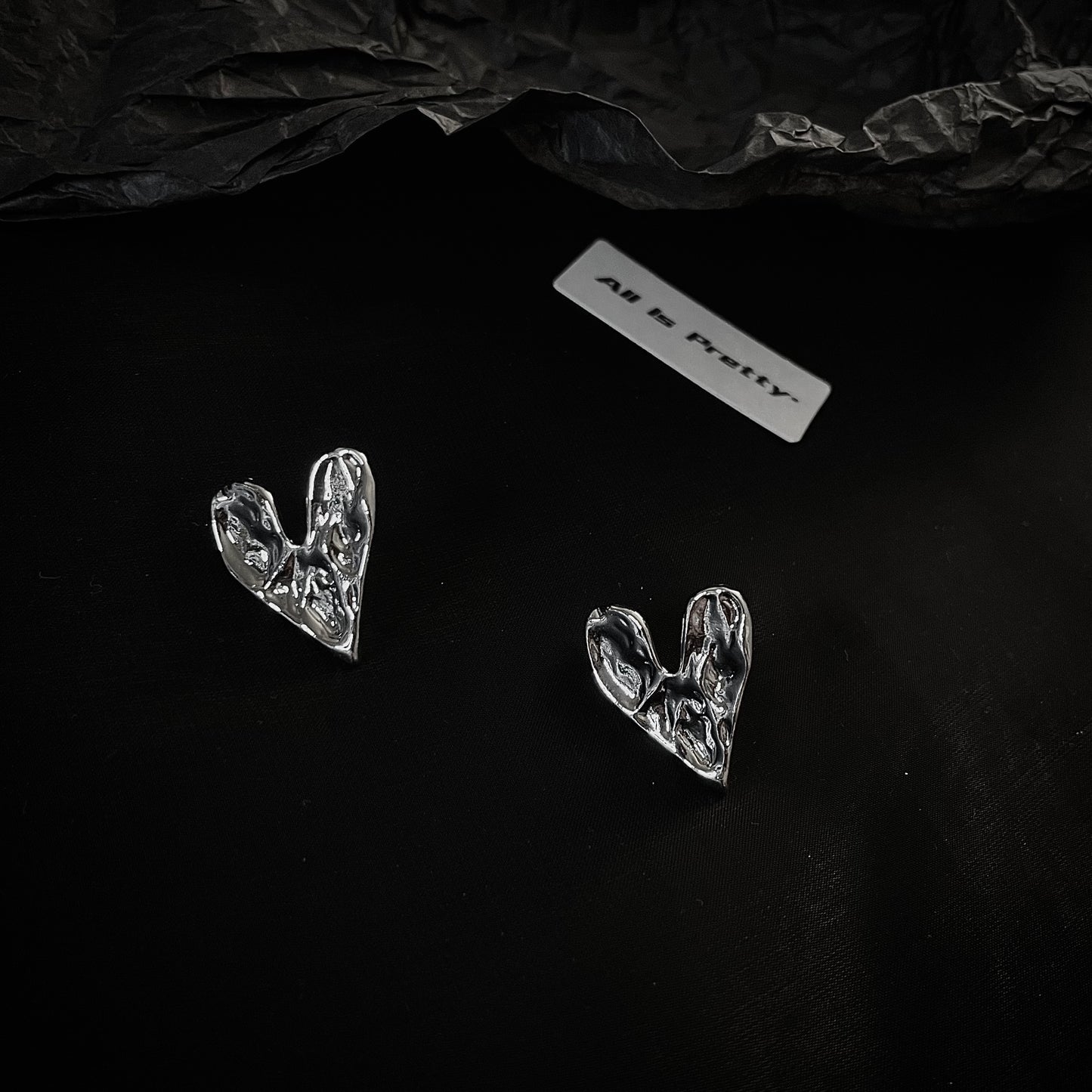 Rough heart shape studded earrings