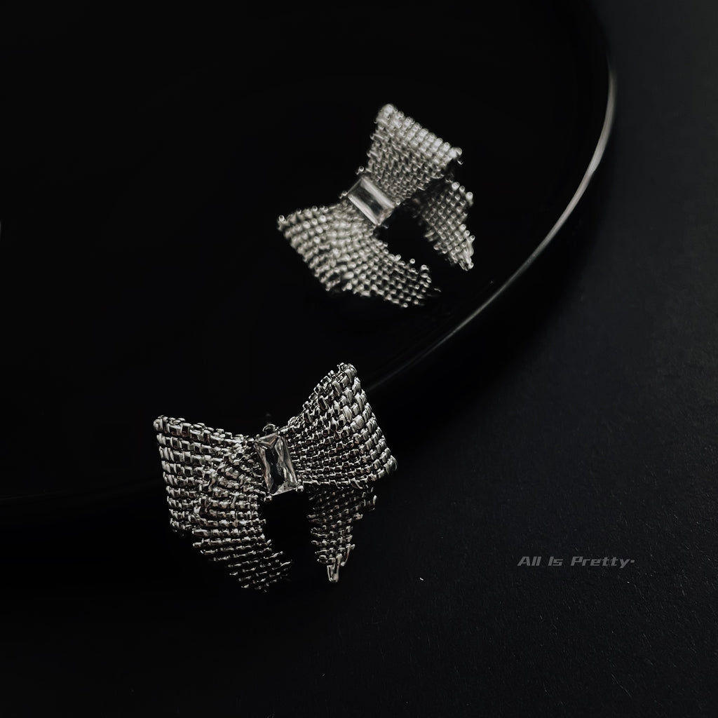 Textured bow studded earrings
