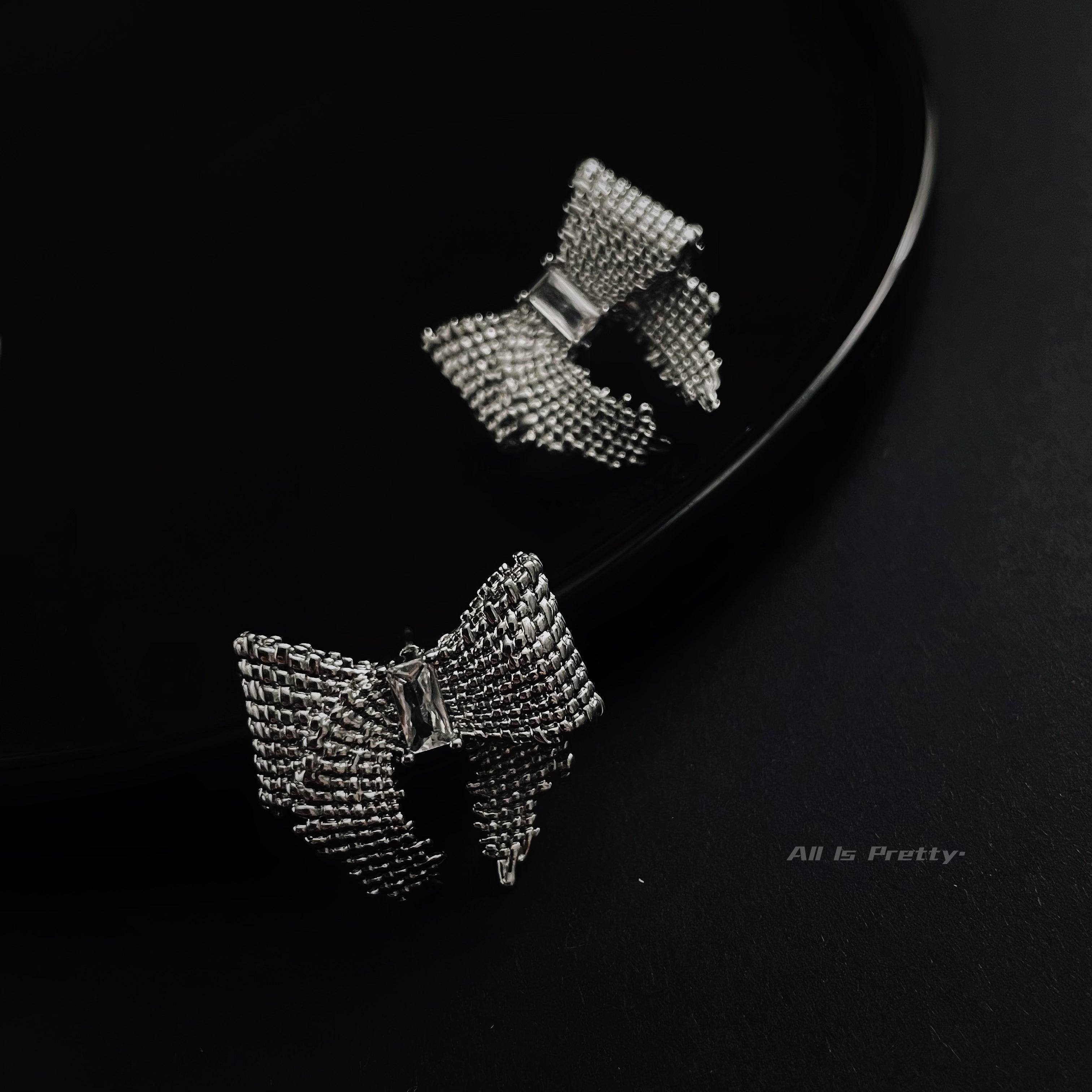 Textured bow studded earrings