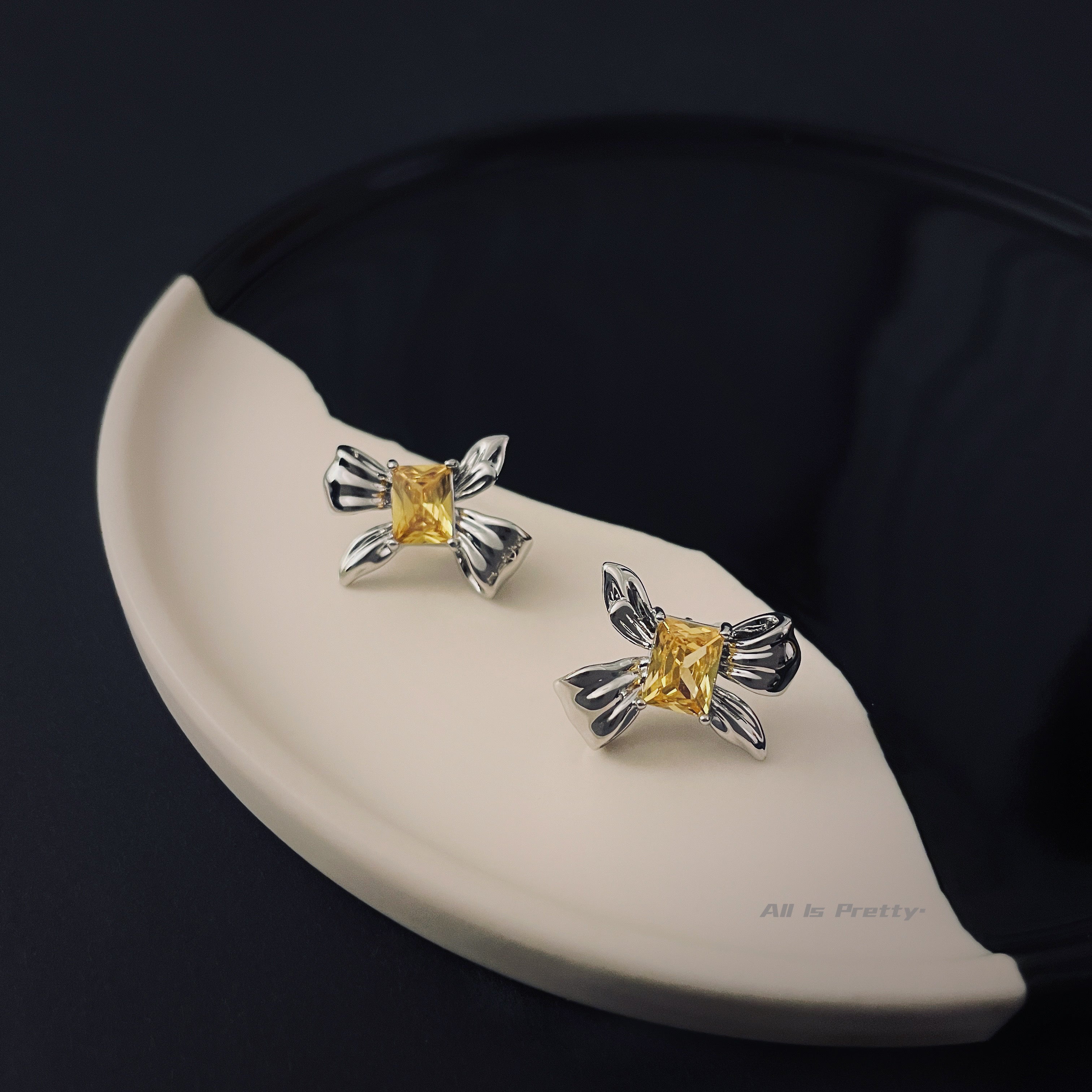 Yellow crystal bow stud earrings