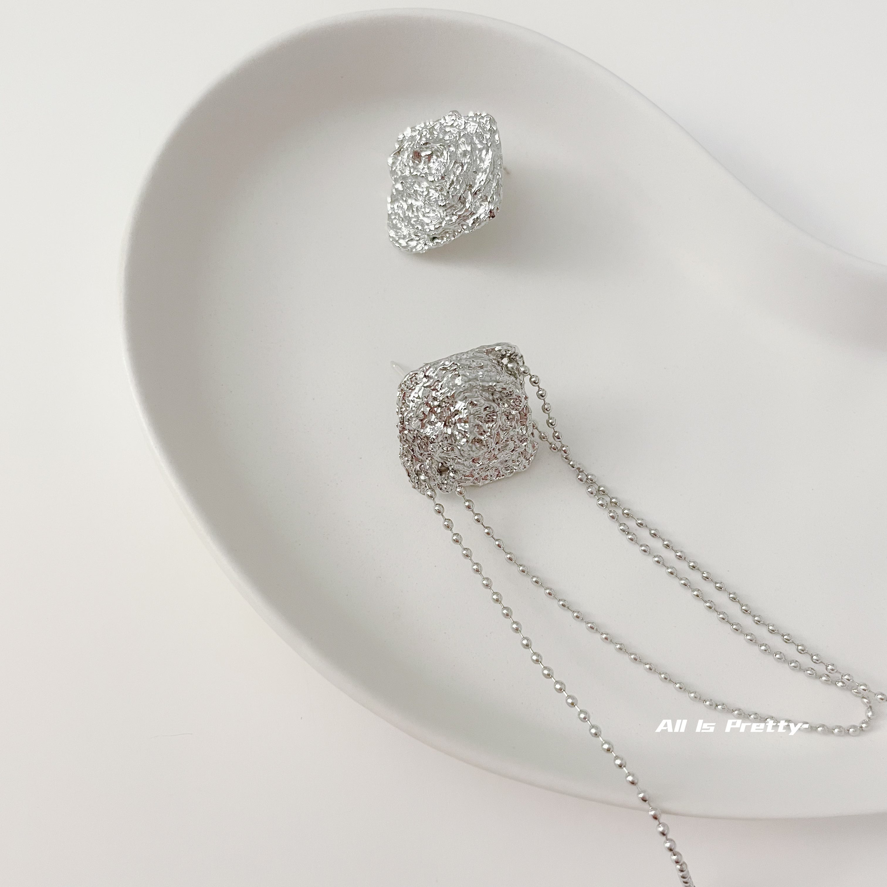 Unbalanced textured rose earrings