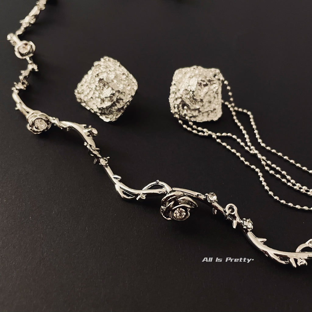 Unbalanced textured rose earrings