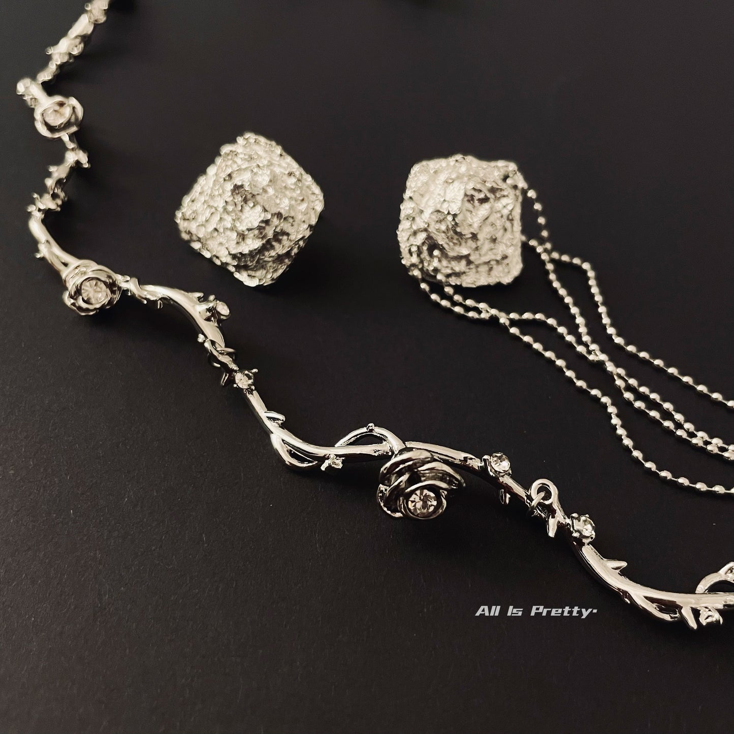 Unbalanced textured rose earrings