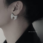 Textured bow studded earrings