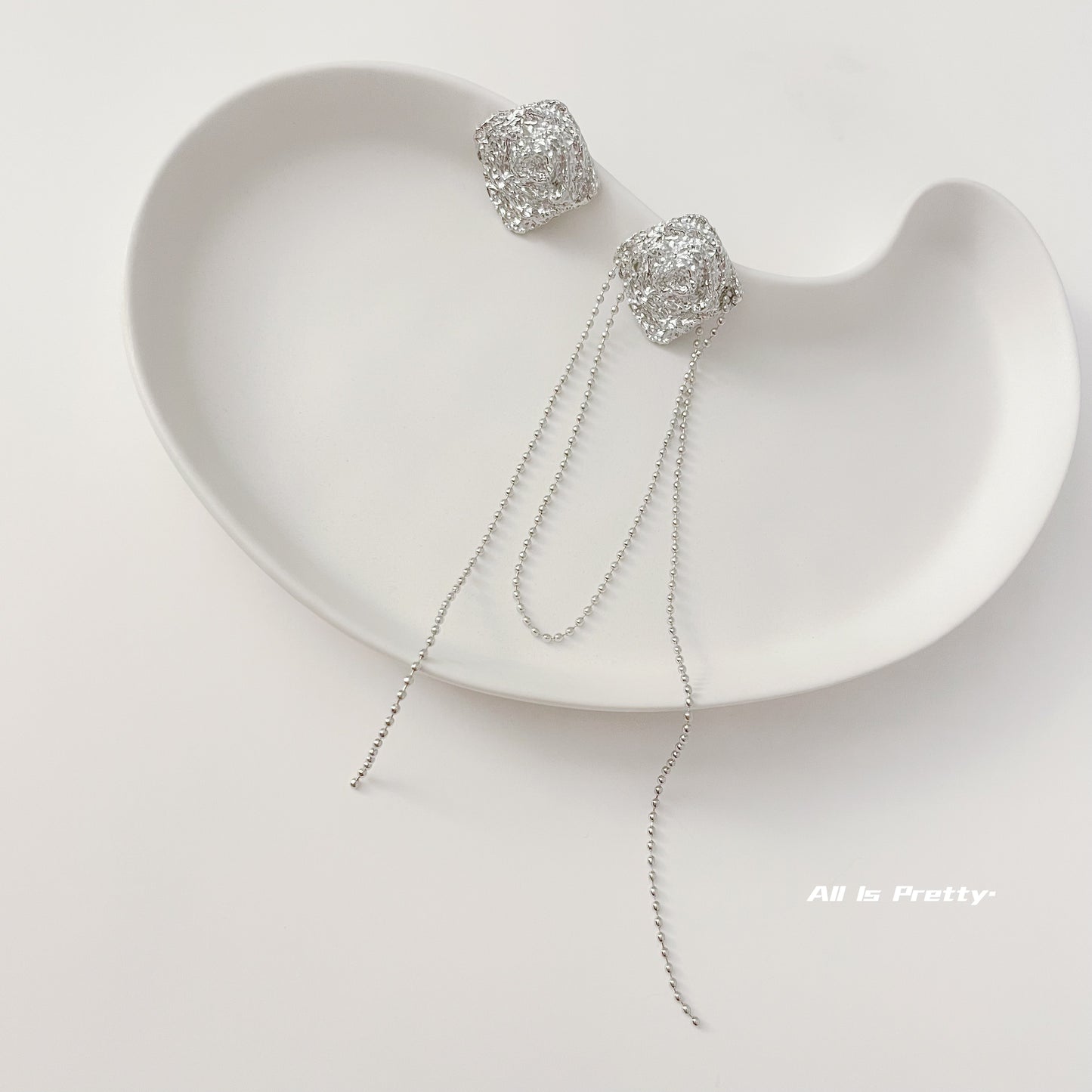 Unbalanced textured rose earrings