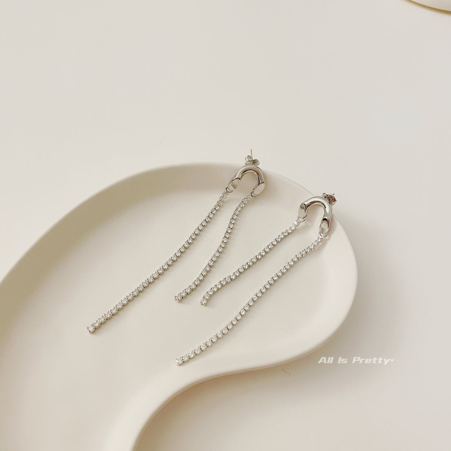 Asymmetric tassel zirconia earrings