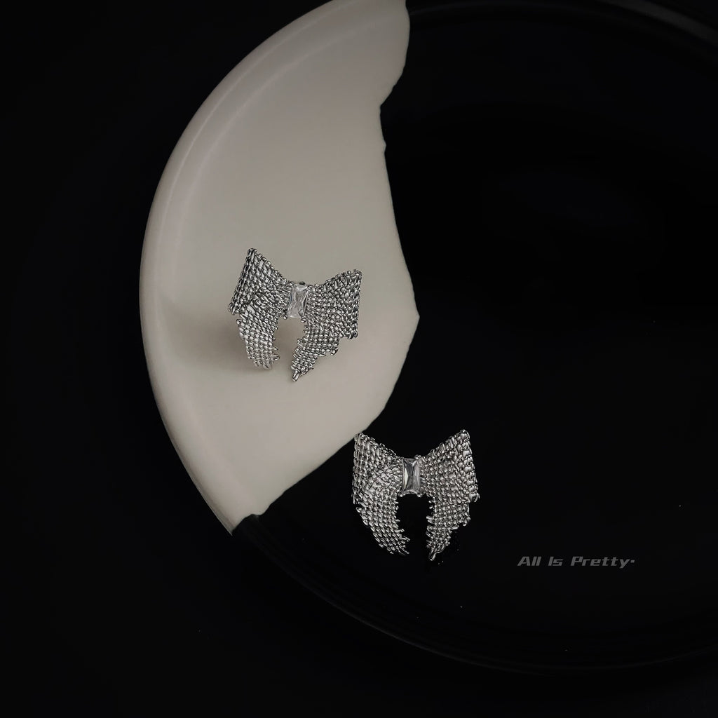 Textured bow studded earrings