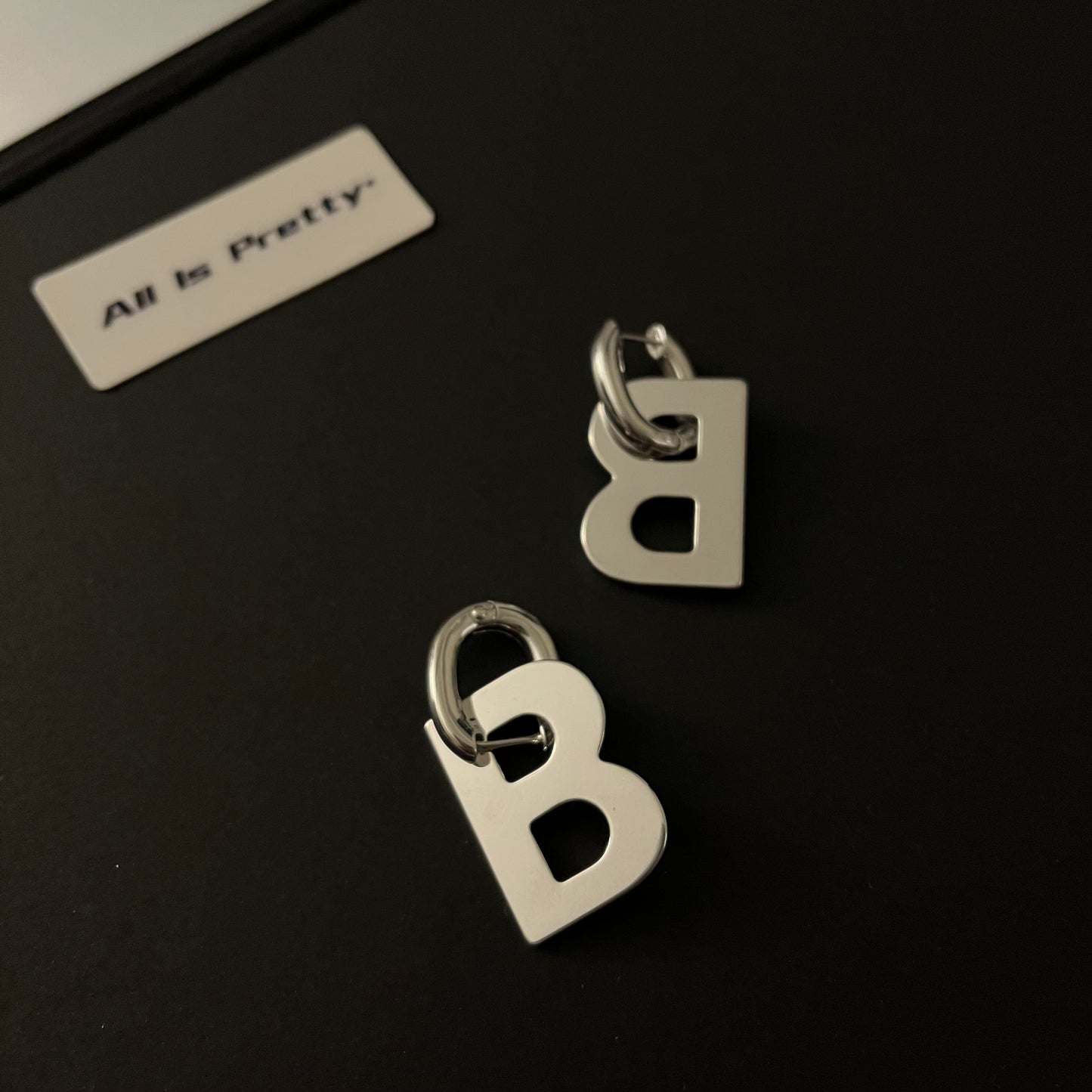 “B” earrings