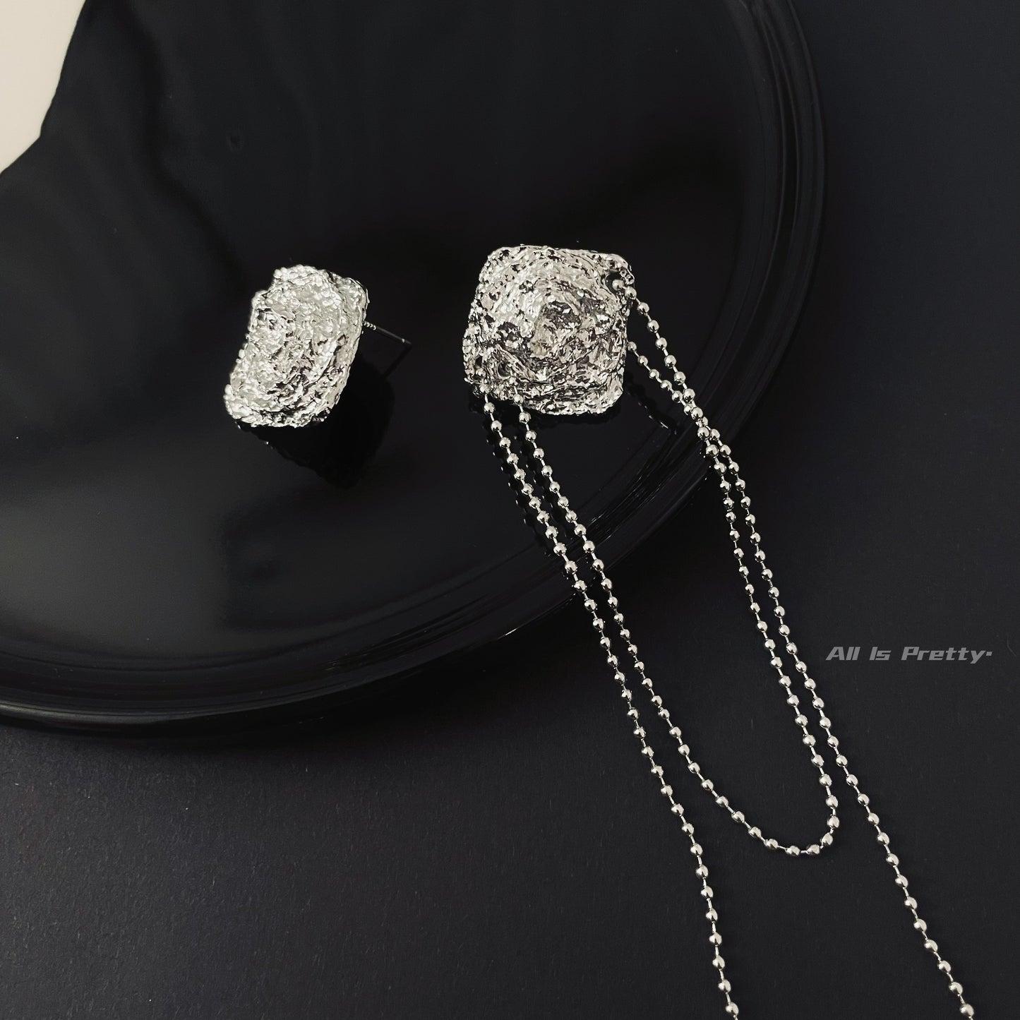 Unbalanced textured rose earrings