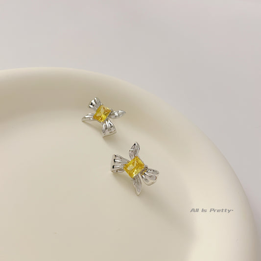 Yellow crystal bow stud earrings