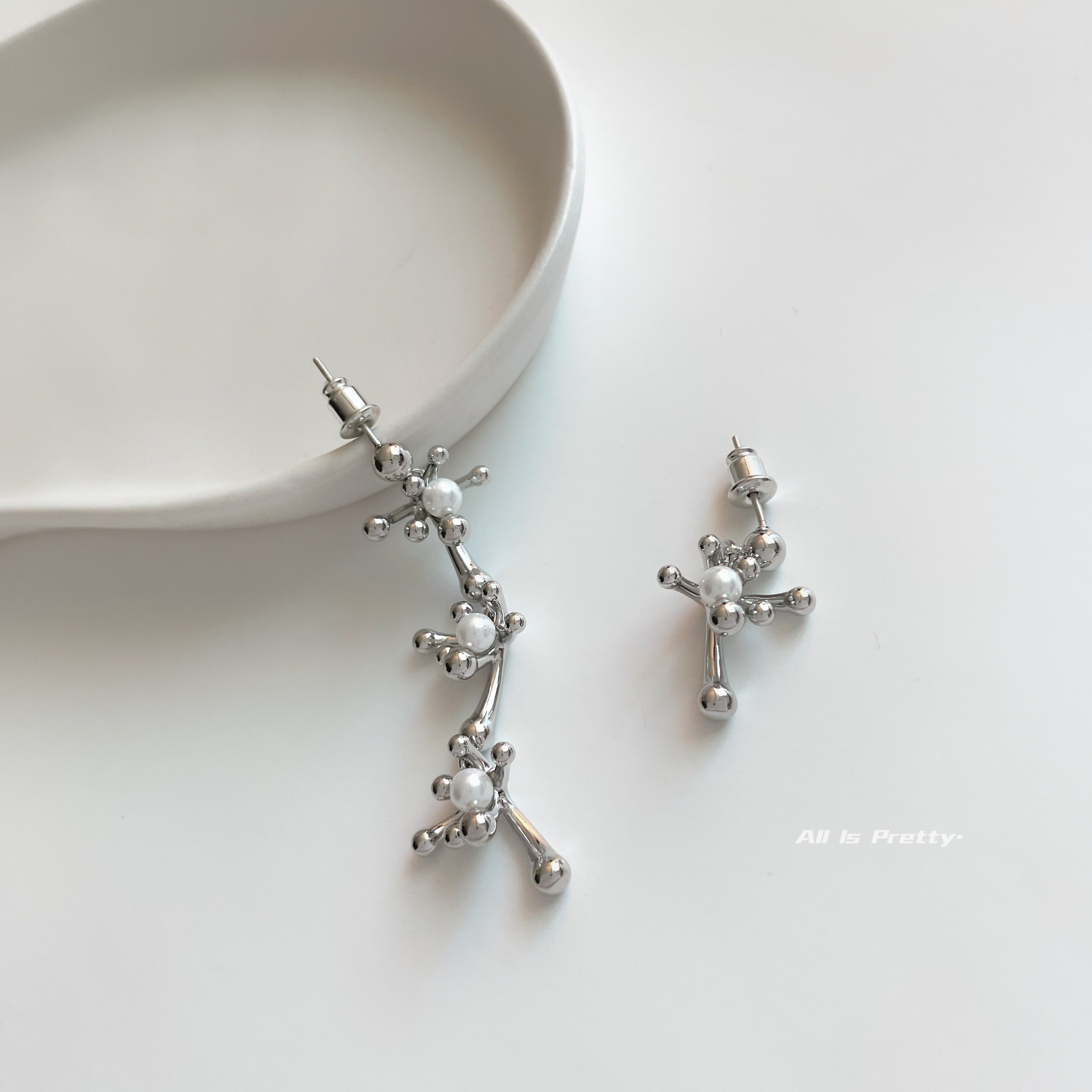 Snowflake unbalanced earrings