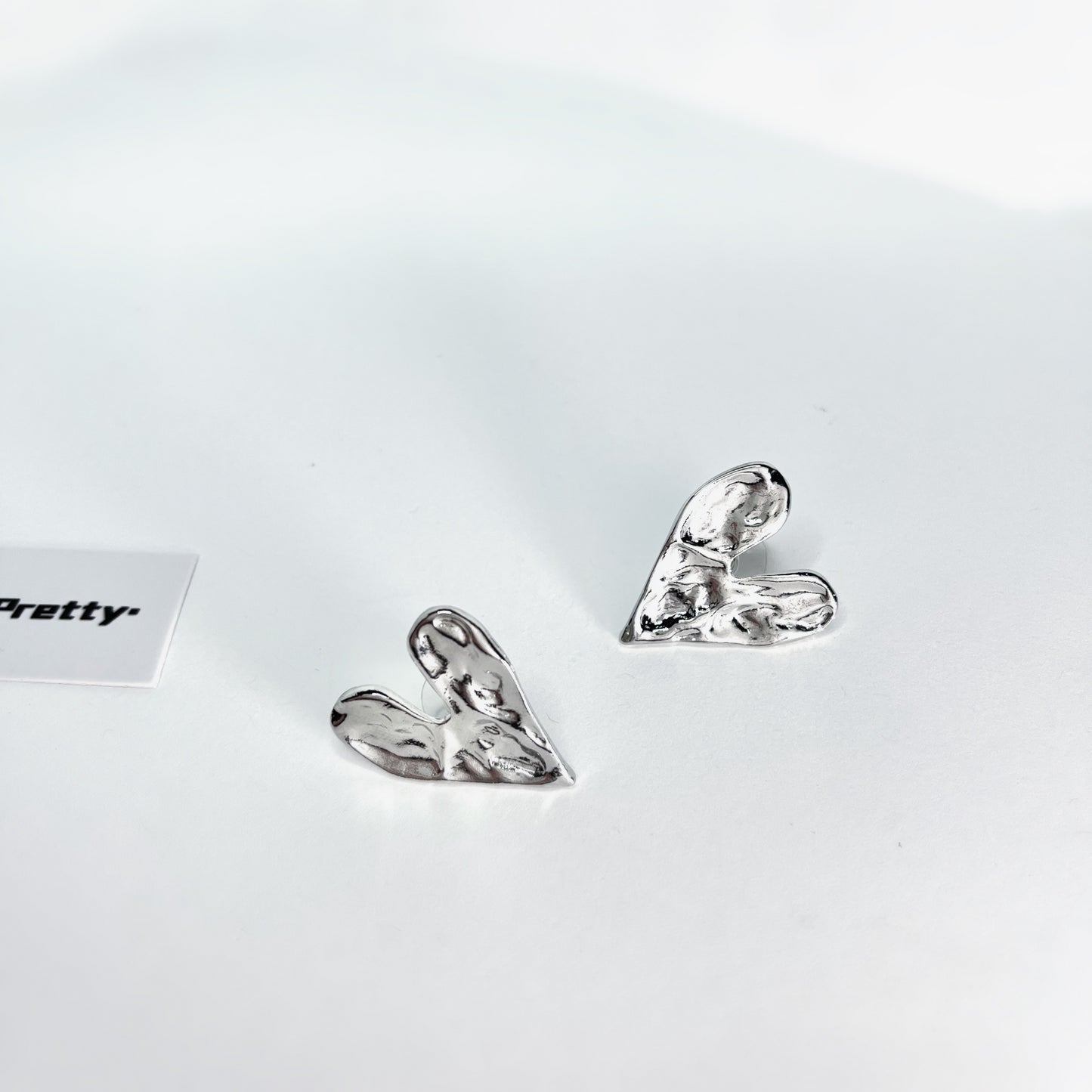 Rough heart shape studded earrings