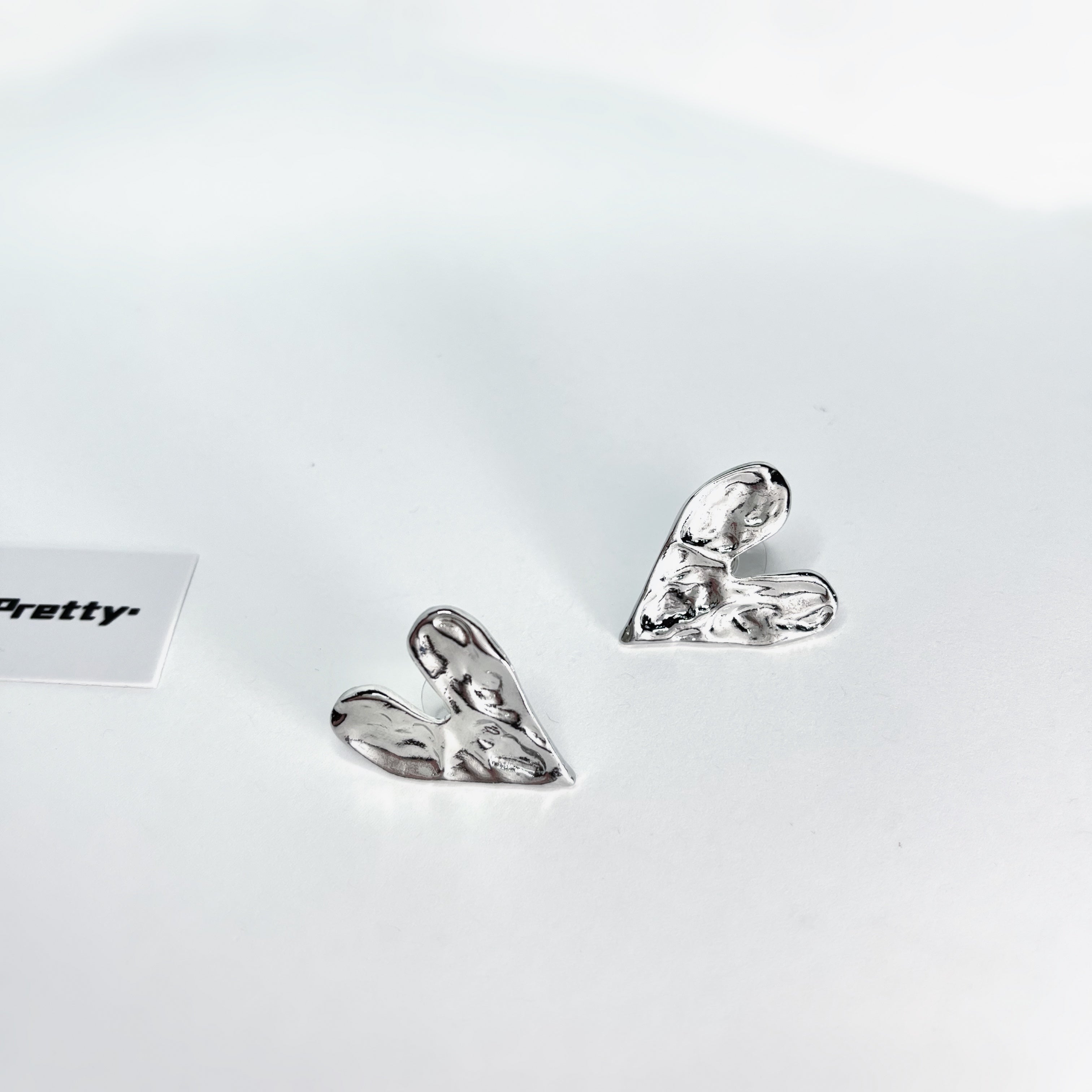 Rough heart shape studded earrings