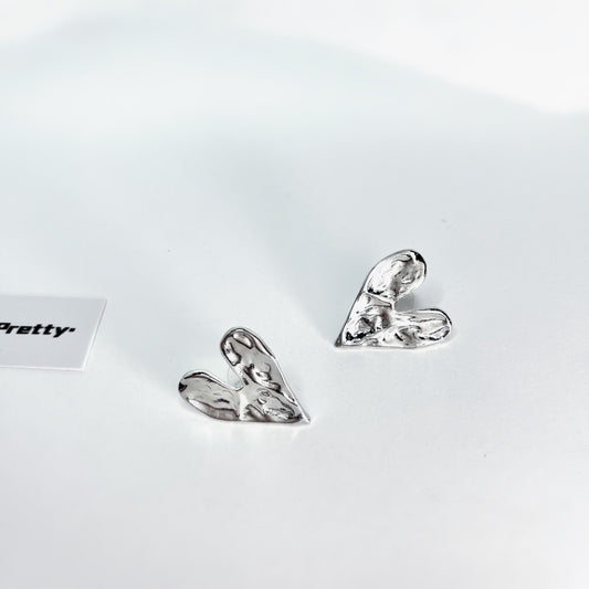Rough heart shape studded earrings