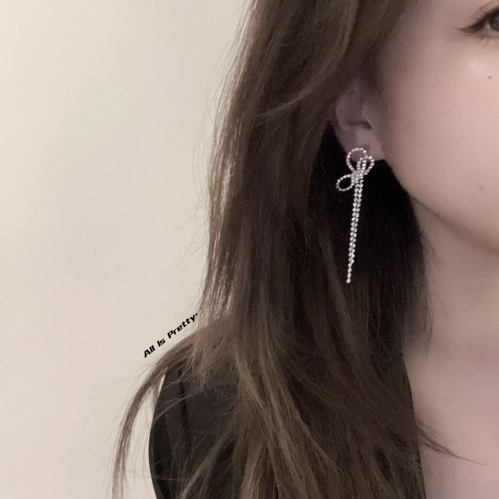 Crystal bow tassel clip earrings