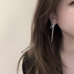 Crystal bow tassel clip earrings