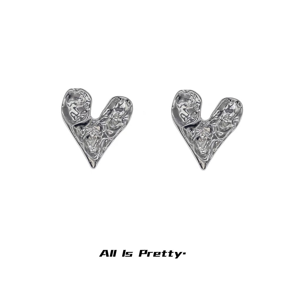 Rough heart shape studded earrings